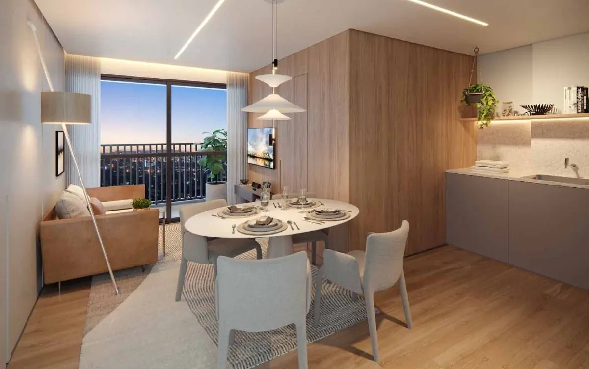 O living do decorado de 41 m²: a mesa redonda, o sofá, a cozinha de marcenaria clara e a porta de vidro para o terraço.