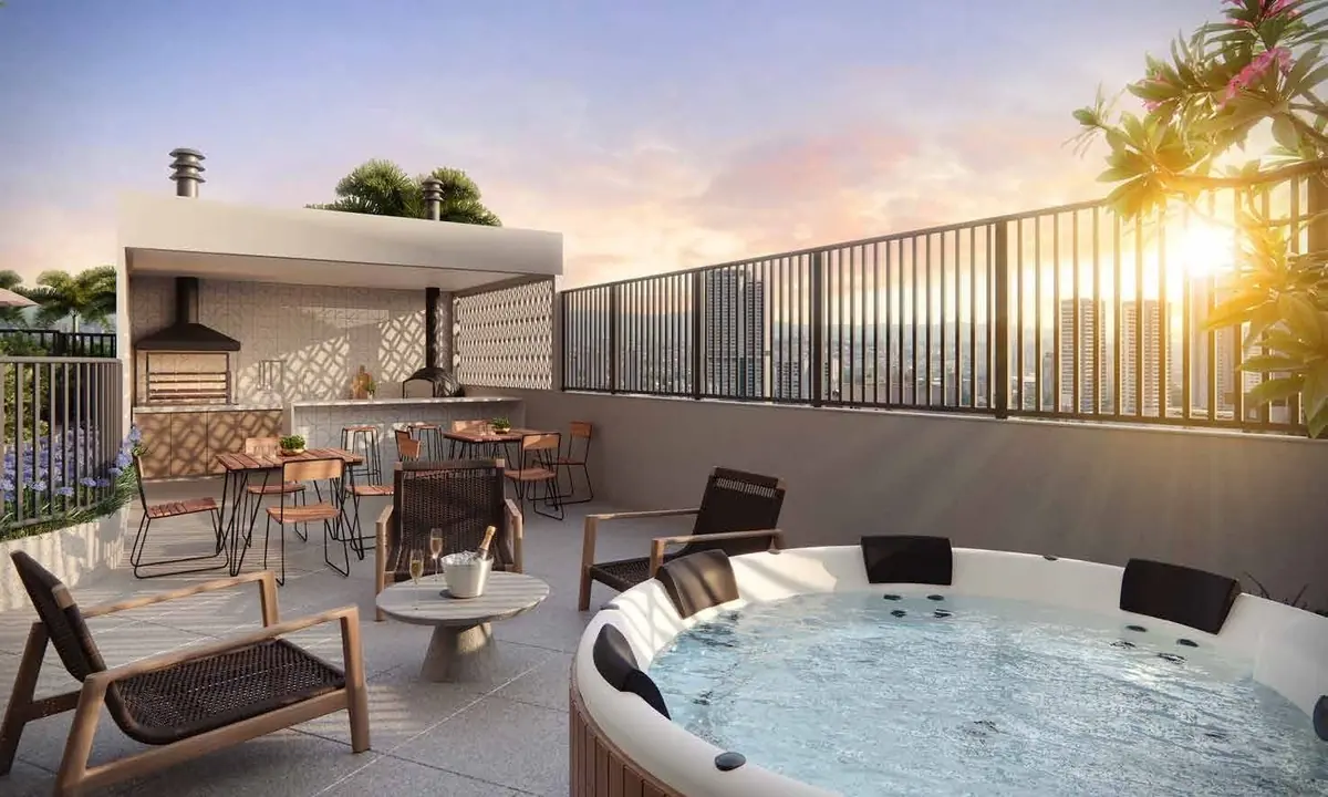 O VIP space ao pôr do sol: uma hidromassagem redonda num deck, com poltronas e uma churrasqueira coberta.