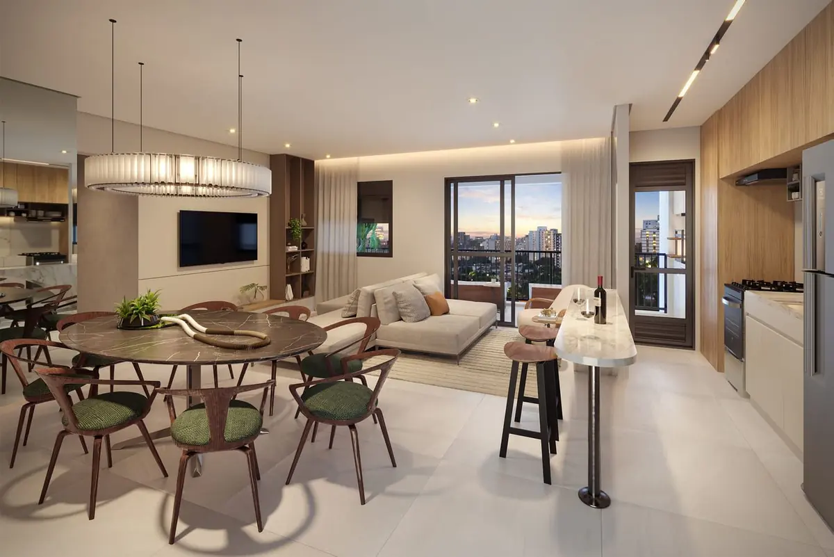 O living ampliado de 85 m²: a mesa de jantar sob um lustre redondo, o sofá e a cozinha americana.